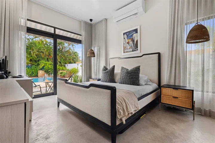 NEW Primary Bedroom with modern concrete floors, new curtains includig blackouts and Desk Built In by California Closets