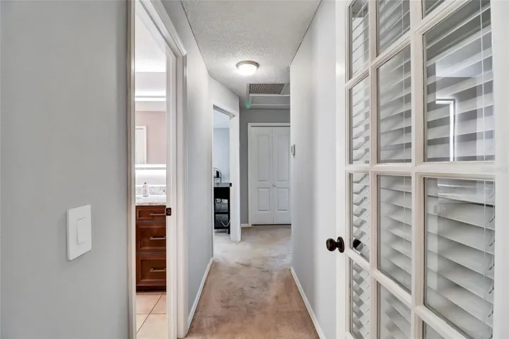 Hallway to guest bathrooms/bedrooms