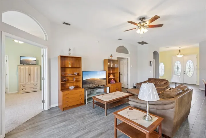 Family Room w/ French doors that open to the Primary bedroom and office