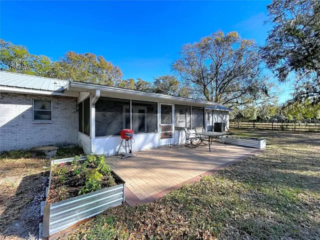Back paver BBQ deck & two raised beds for your herb garden