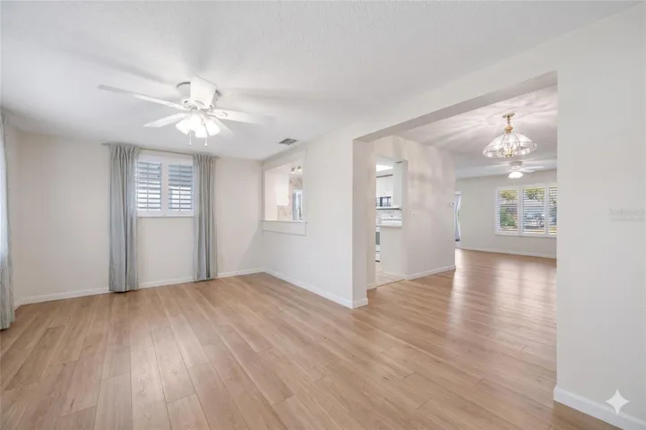 Virtually staged to represent flooring allowance offered by seller