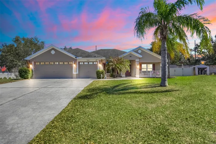 Front of home with 3-car garage & additional parking space