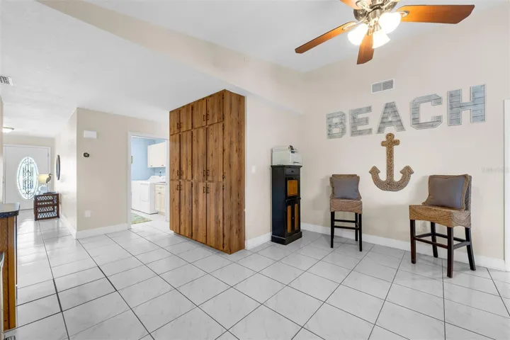 Family room area. Additional 3 bedrooms and 2 1/2 baths on this side of the house. Cathedral ceilings and ceiling fans.  Plenty of storage.