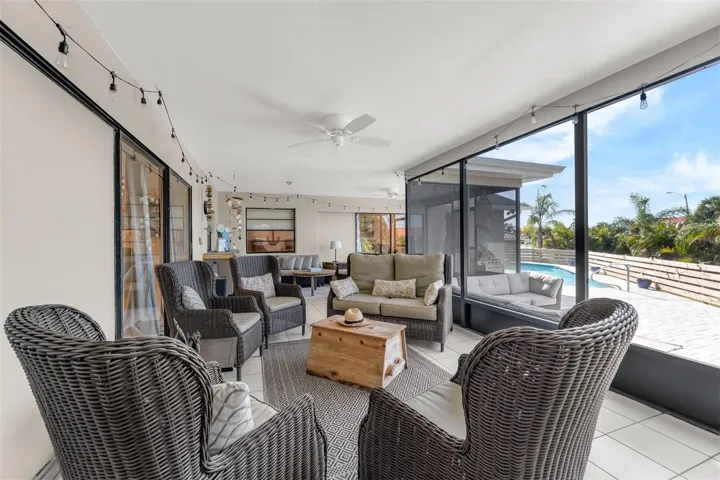 View from primary bedroom to family room and outside pool deck.