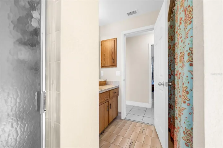 Looking out of bathroom #3 into hallway between bedroom #3 and #4.  Hallway measures 3'2