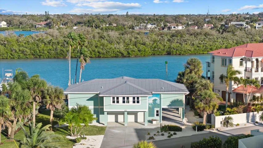 Aerial View with Intracoastal Waterway Behind the Home