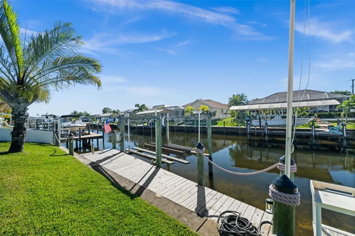 9,000 lb boat lift and captain's walk just steps from the lanai