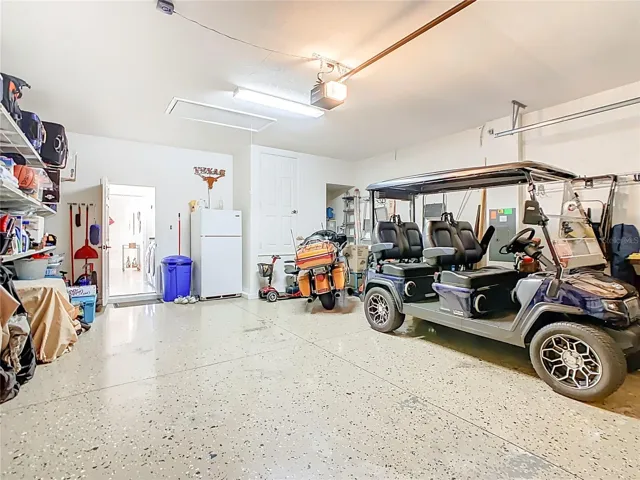 Additional Refrigerator Included in Sale. Pull Down Stairs with Partial Flooring for additional Storage