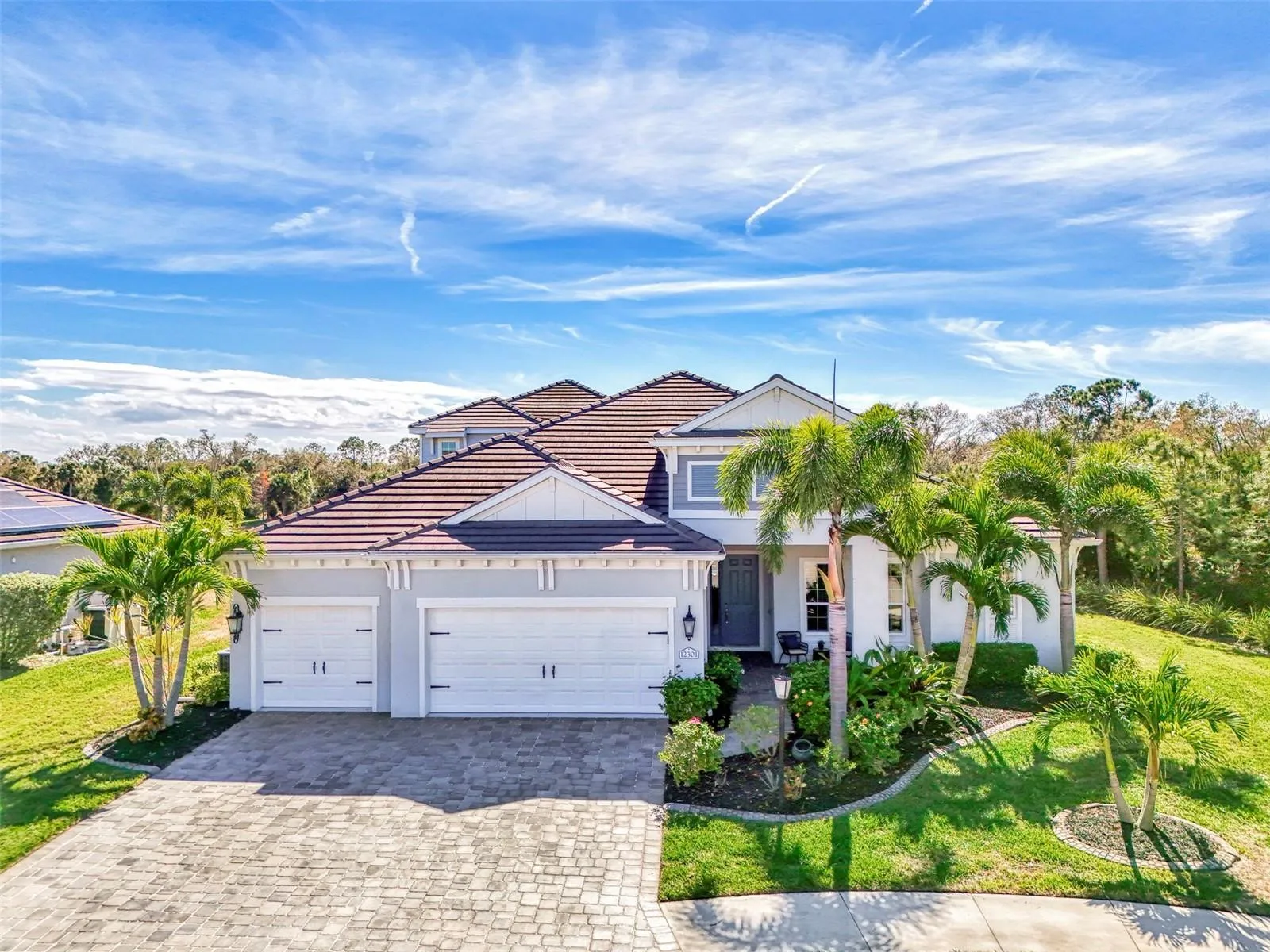 Private, end-of-cul-de-sac lot with landscaped grounds and water views.