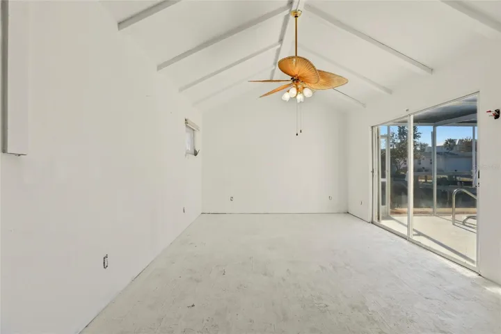 primary bedroom looks out to pool and water