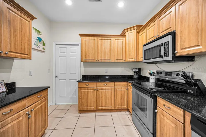 Doorway leads to laundry and 2 car garage