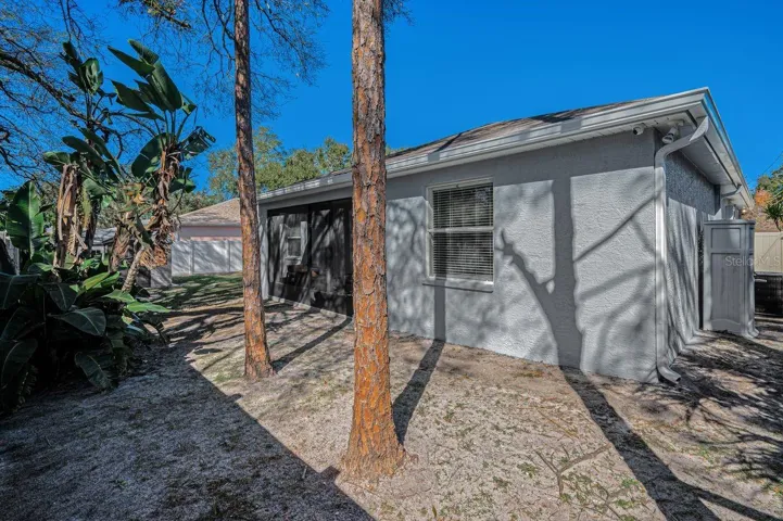 Smaller storage shed just outside the garage, plus a gate to front of the house.