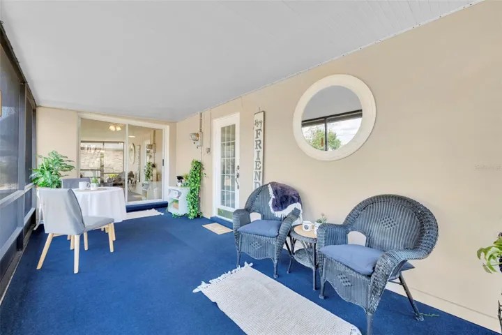 RESCREENED and RECARPETED 4  years ago! This 20.8 x 8.9 SPACIOUS lanai has both the single door entry and the large glass sliding doors leading to the dinette/breakfast nook area.