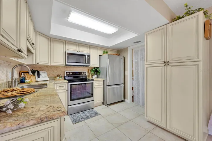View of the oversized kitchen pantry, newer or new stainless steel,  appliances ALL STAY!