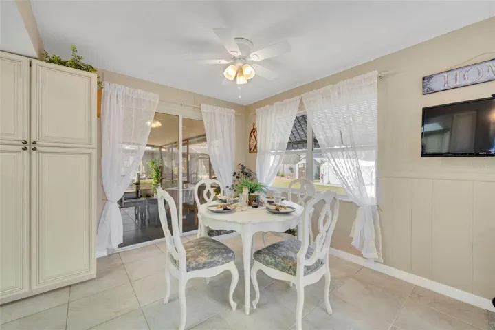 Nicely Sized Dinette or Breakfast nook YOUR CHOICE situated between a large window and oversized set of sliding glass doors leading to the Lanai.