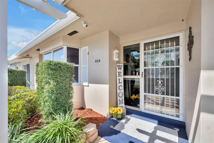 AWE! WELCOME TO YOUR HOME! 5.3 x 4.6 newly carpeted front covered porch.
