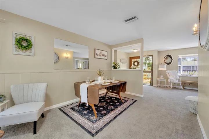 Another view of the dining room looking to the front door and living room.