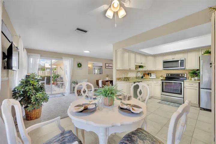 SUCH SPACE as you can see from the view of the dinette leading to the kitchen on right and other set of sliding doors leading to the expansive back patio.