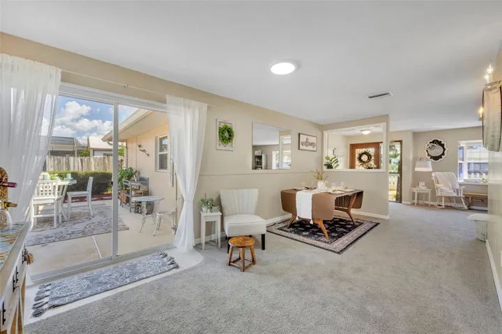 Dining room looking to the sliding glass doors leading to the oversized outdoor patio. With view of dining room area