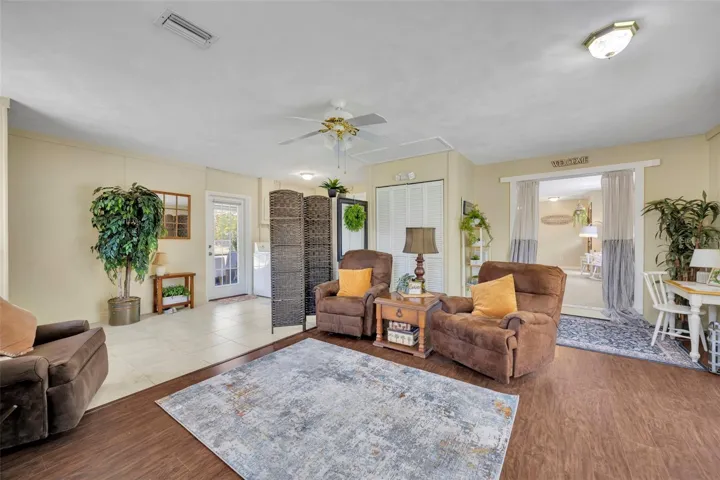 Great room has a set of large glass sliding doors with an retractable awning on the exterior of the doors. Allowing to limit the light coming in and sit outside to enjoy the view, have coffee or tea and relax.
