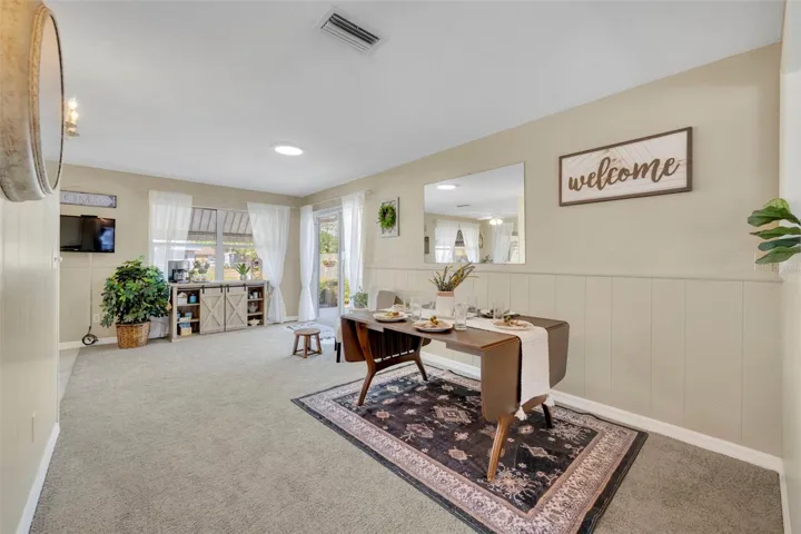 19.7 x 9 Dining room with tons of natural light and sliding glass doors leading outside