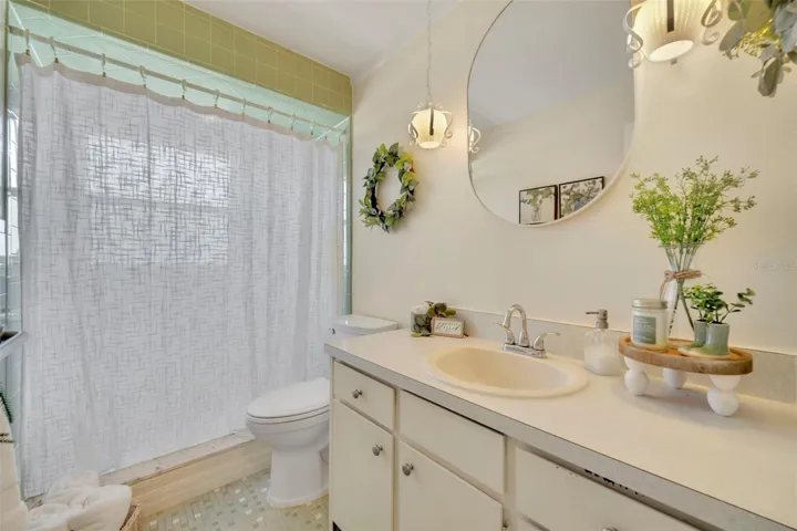 11.6 x 9.8 second bathroom with FULLY TILED walk in shower!   This BEAUTIFUL SAGE Green in the EXACT 2026 bathroom color trend that is ALL OVER THE INTERNET!