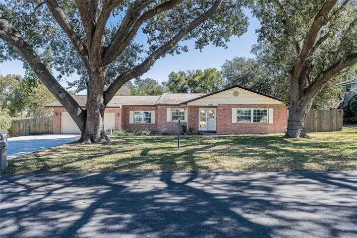 Front view of home with mature trees