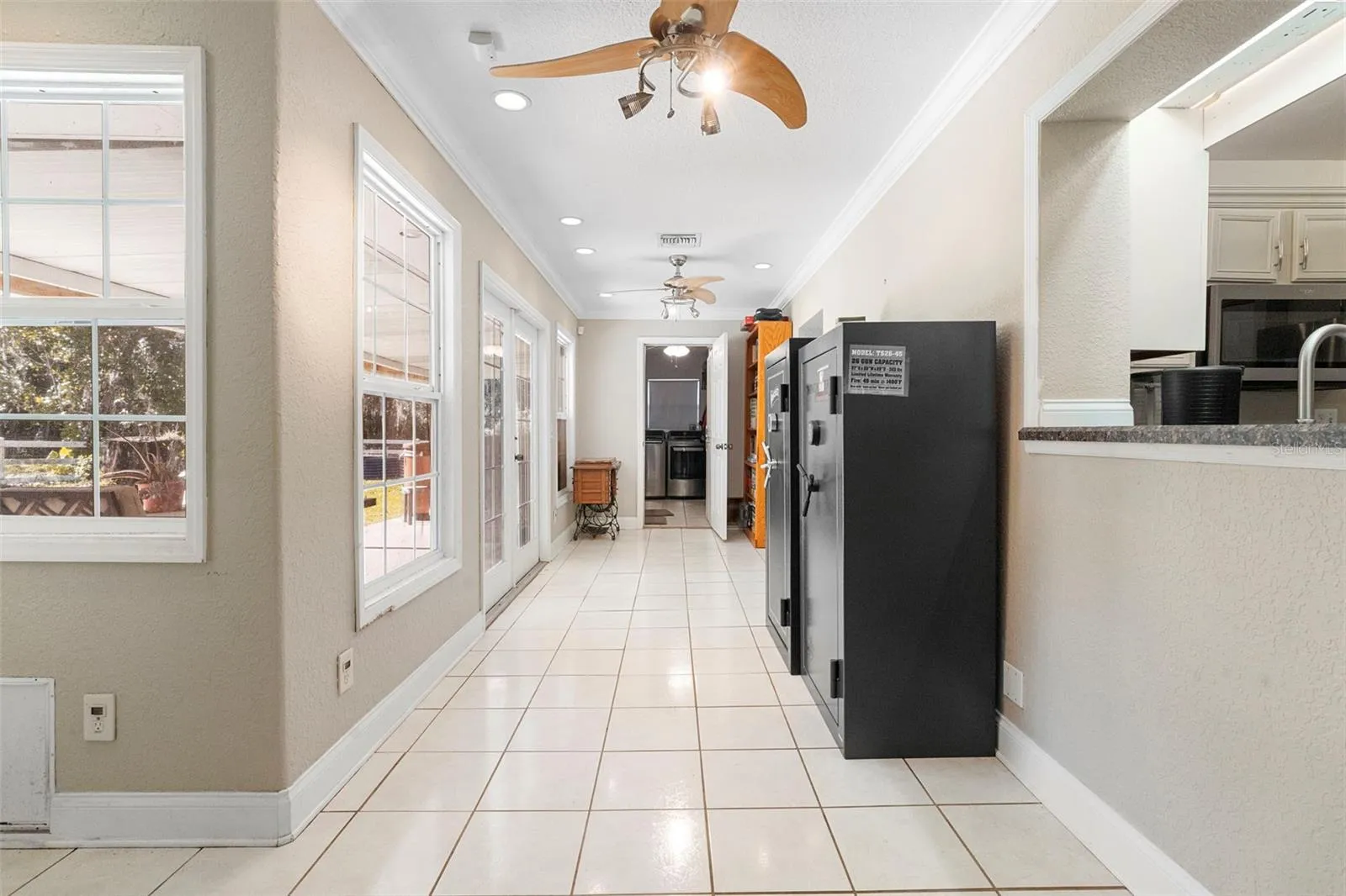 hallway to kitchen, bar and laundry