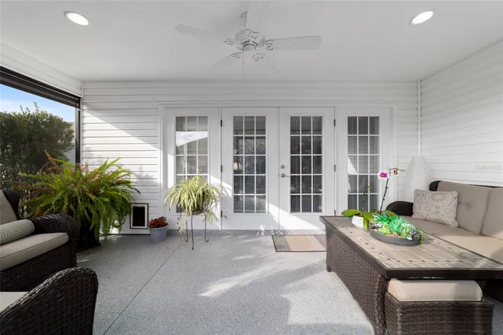 Livingroom doors open to the screen lanai