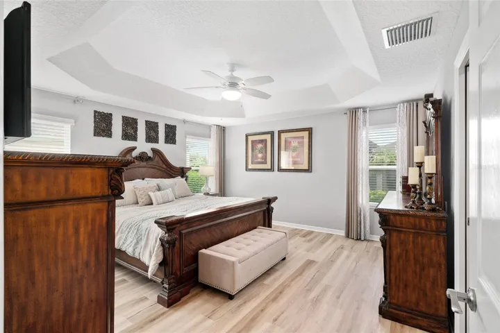 Spacious primary bedroom comfortably accommodates a king size bed