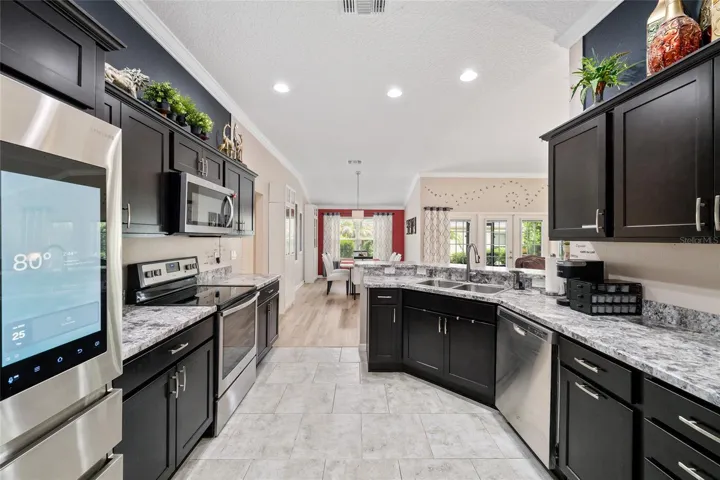 Espresso cabinetry, stainless steel appliances