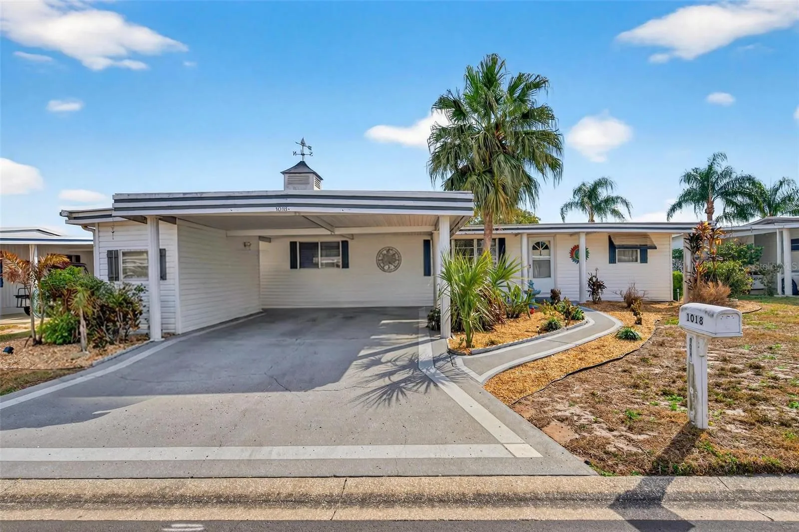 Front featuring a double carport