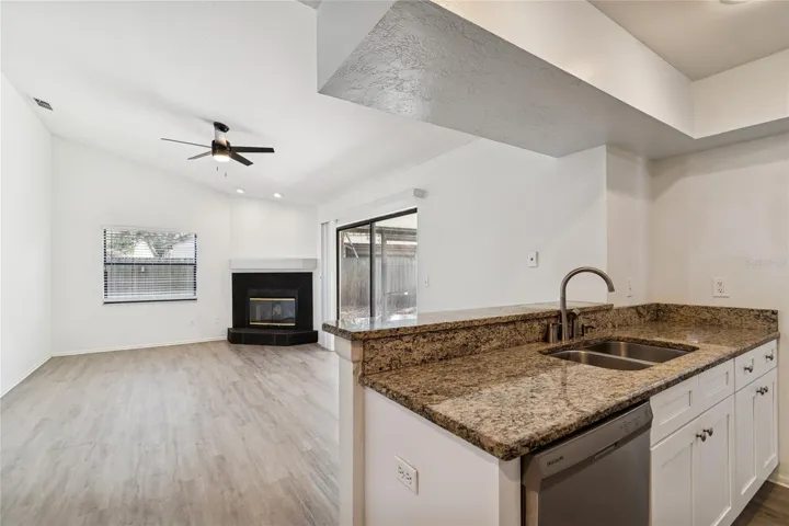FAMILY ROOM WITH FIREPLACE FROM KITCHEN
