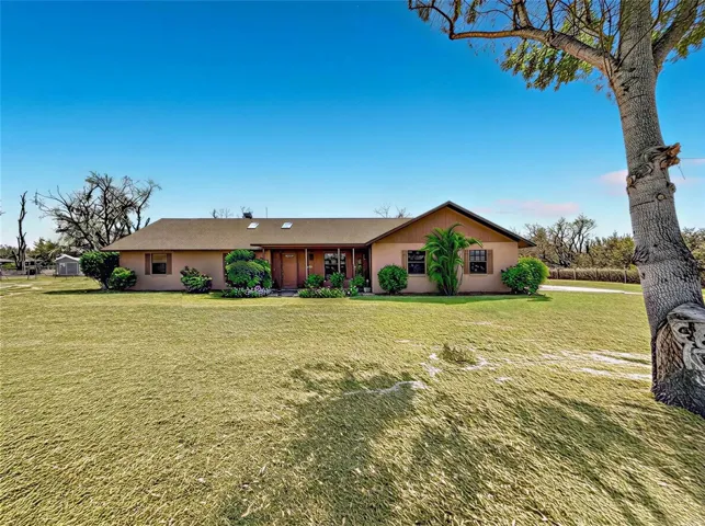 3/2  one story, ranch home 2 car garage on .89 of an acre with double fencing for live animals and garden spaces.