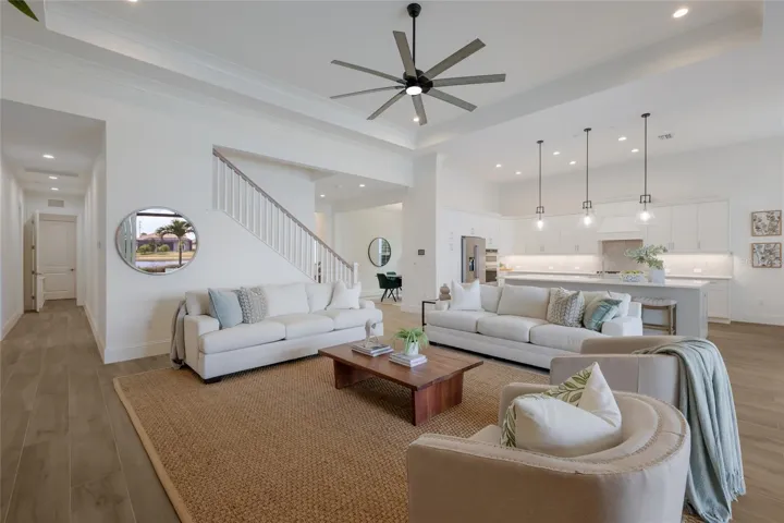 Hallway on the left leads to to two guest bedrooms, laundry room and garage.