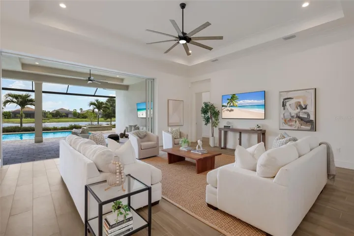 Pocket sliders from great room to lanai blend indoor/outdoor living seemlessly.