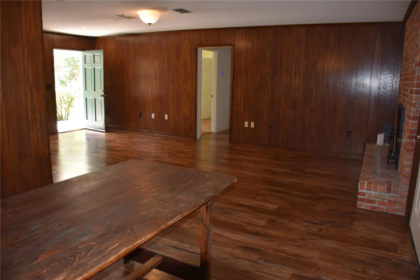 dining room. fireplace right, front door left