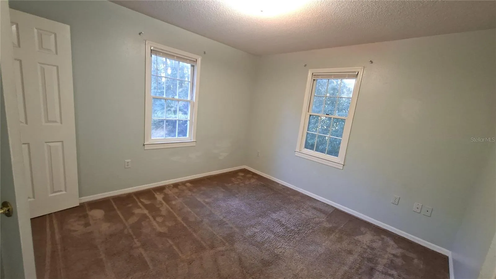 primary bedroom looking out from bathroom