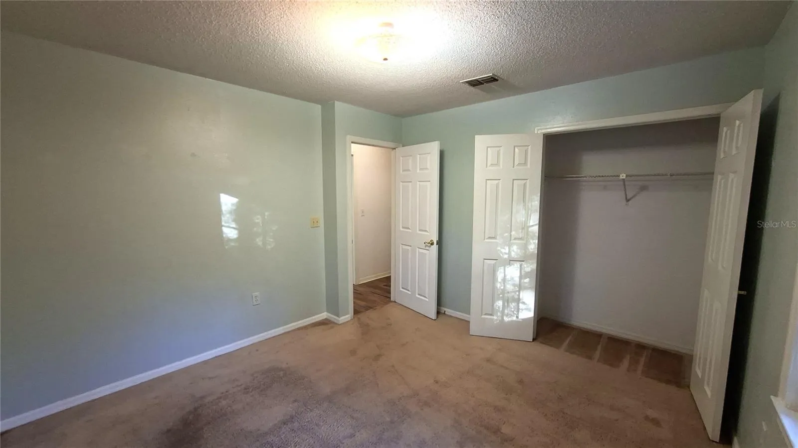 secondary bedroom with built in closet