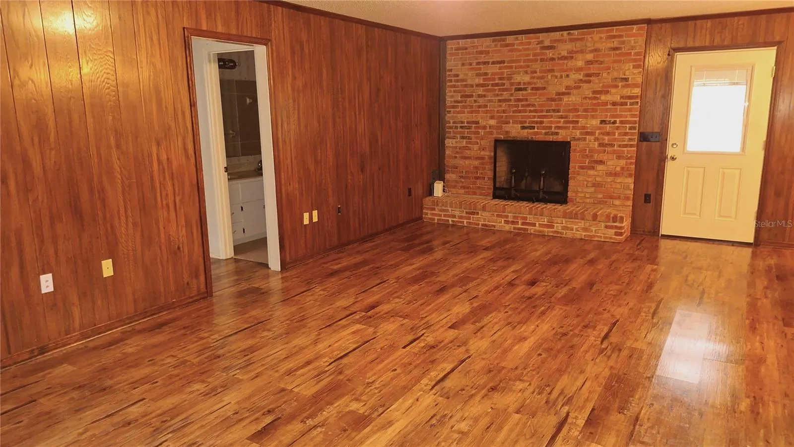 large living room with built in fireplace