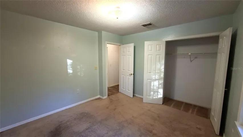 secondary bedroom with built in closet