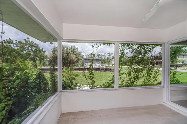 Rear tiled patio overlooking the waterway