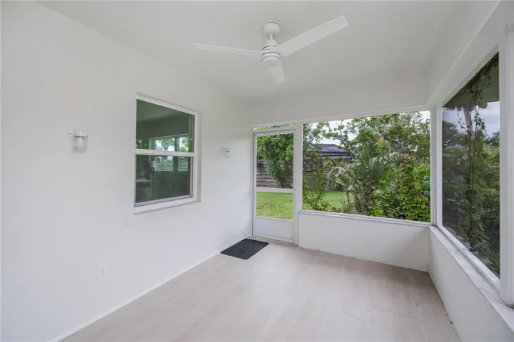 Rear tiled patio overlooking the waterway