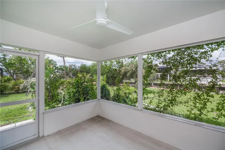 Rear tiled patio overlooking the waterway