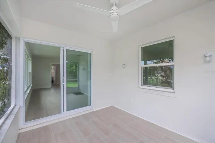 Rear tiled patio overlooking the waterway