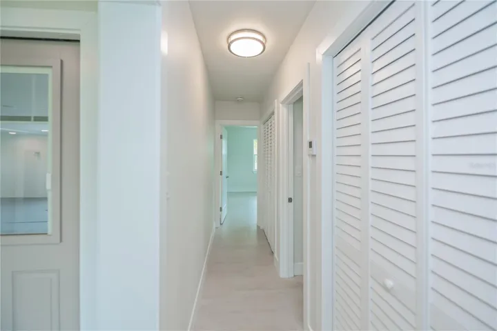 Hallway to guest bathroom and guest bedroom 2