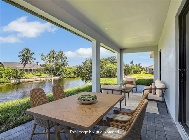 View of patio / terrace with a water view andoutdoor dining space