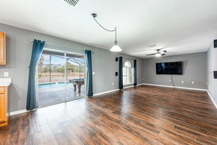 Open family room, dining space and kitchen.