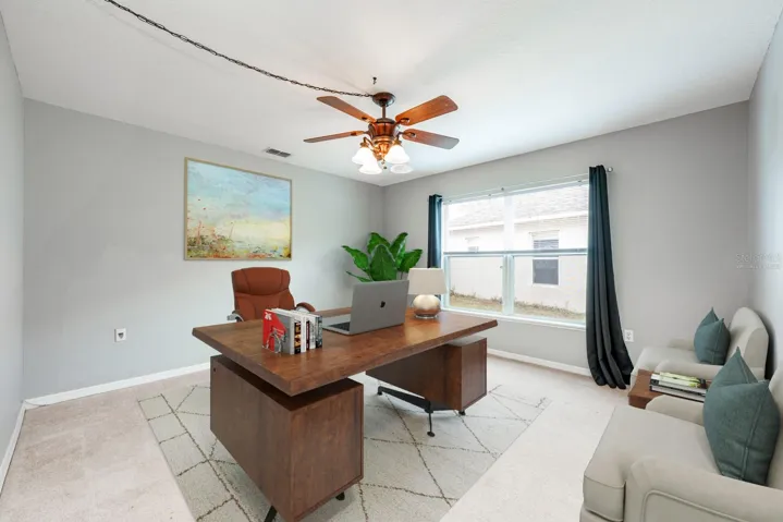 Versatile bonus space on the main floor - use as additional family space, a home office or 5th bedroom!  Virtually Staged.