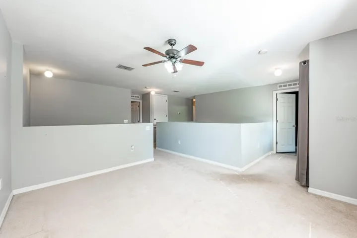 Second floor landing opens to a loft space.
